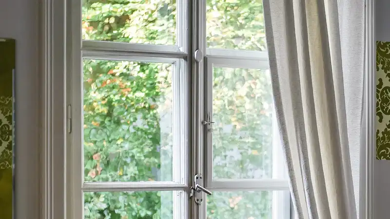 White timber sash window seen from inside