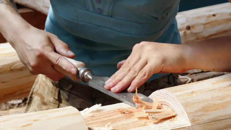 Joiner planing a length of timber